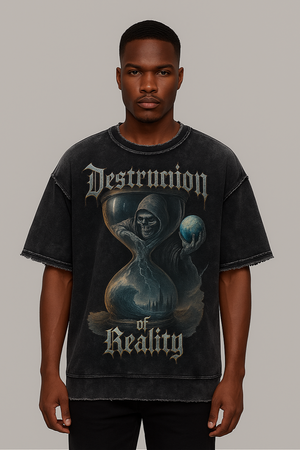 Person wearing a black t-shirt with 'Destruction of Reality' graphic design on a plain background